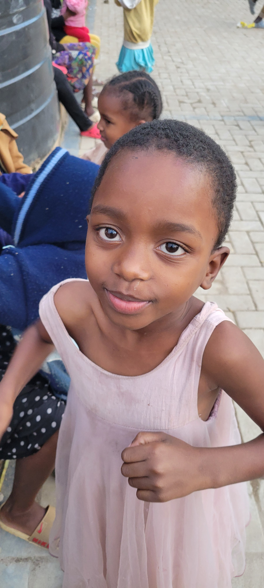 A girl smiling in the courtyard